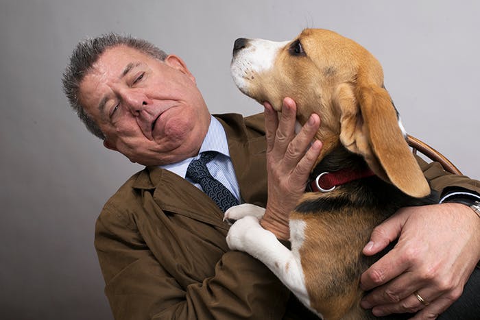 Tom Ahern pictured with an eager beagle dog