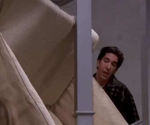 gif of a couch being moved upstairs, from the tv shows Friends