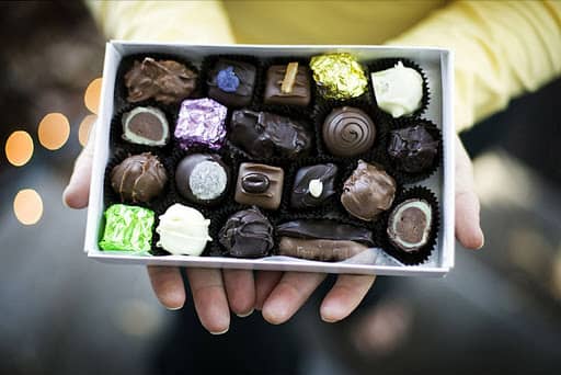 close up of an open box of chocolates