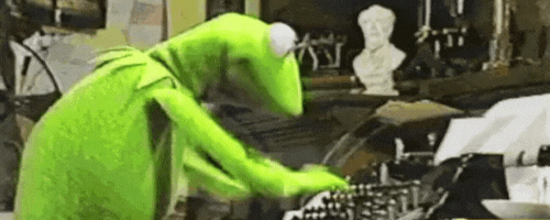 Kermit the Frog furiously typing