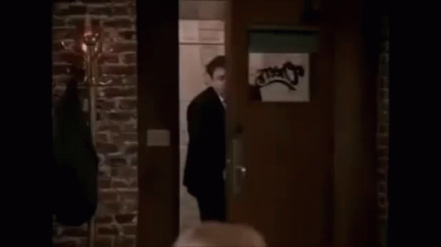 GIF of the tv show Cheers, when George Wendt walks in and everyone shouts "Norm!"