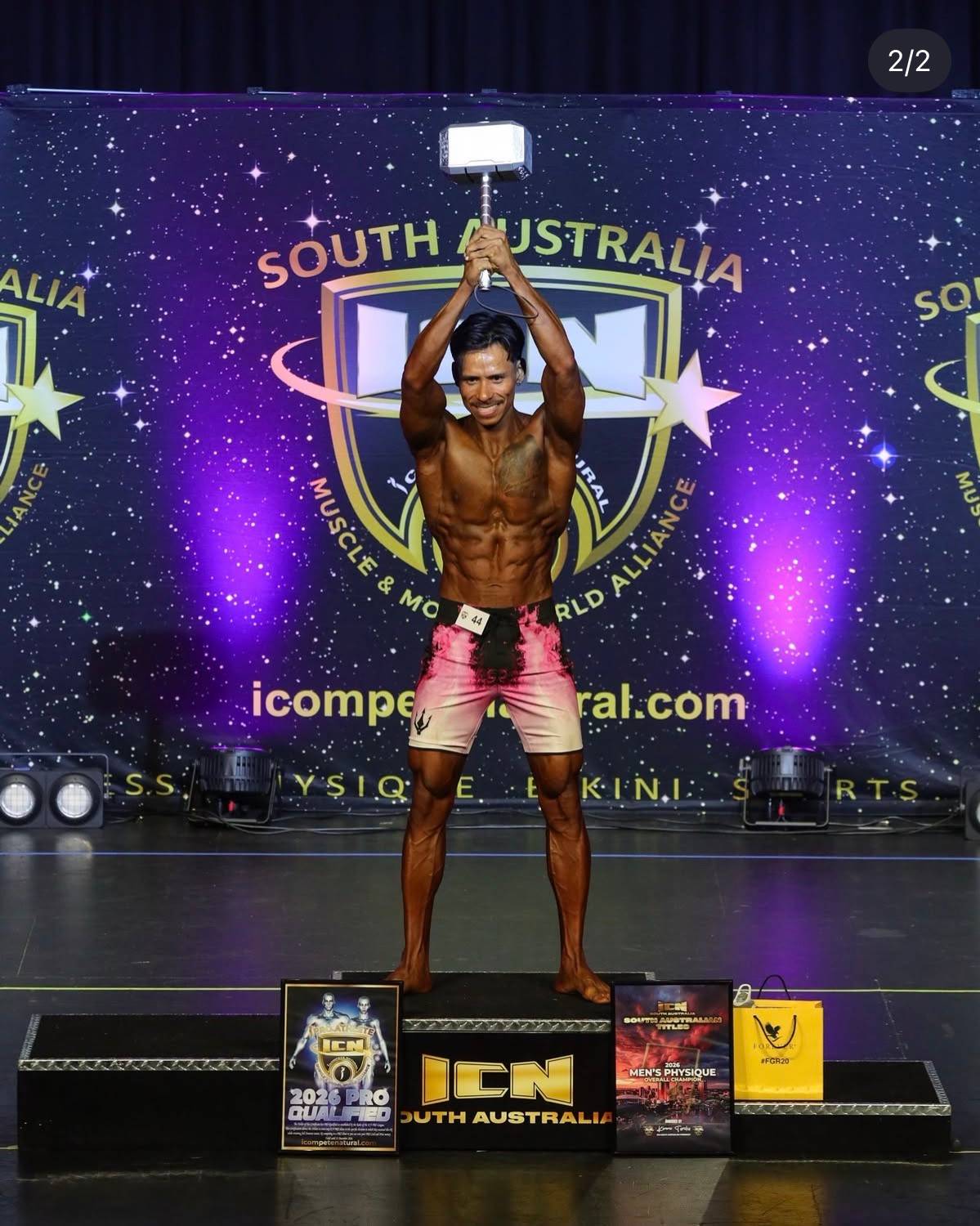 Mario on stage at ICN South Australia 2026, Men's Physique Overall Champion