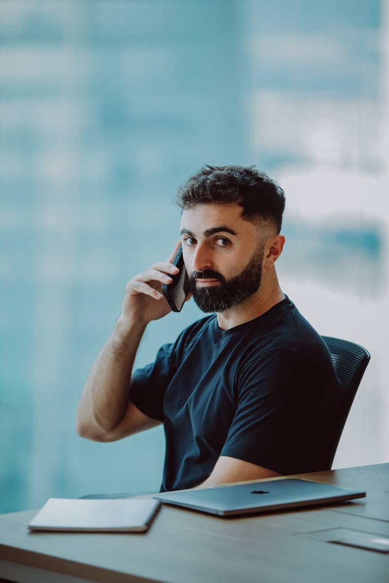 The founder speaks on the phone with clients