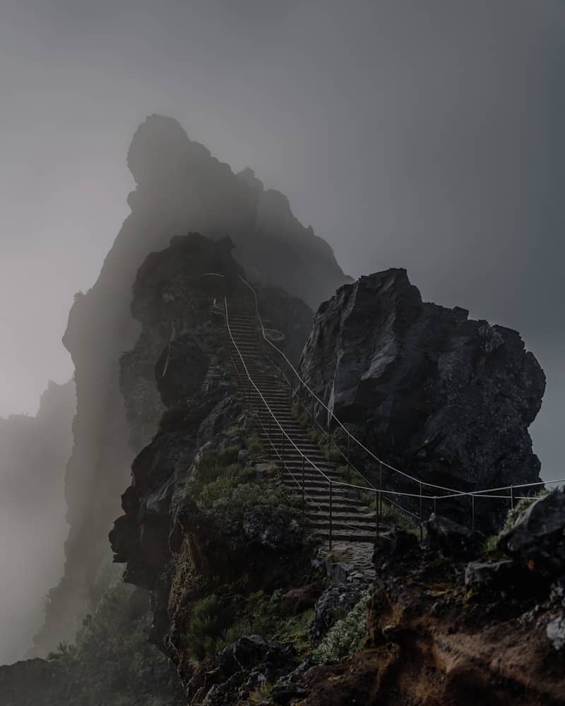 Stairway to a misty mountain peak.