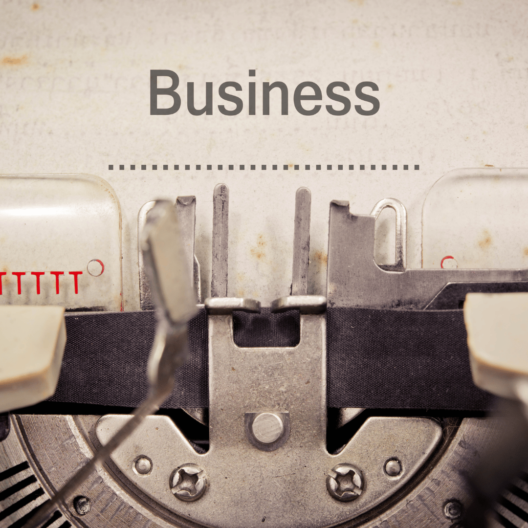 A typewriter typing the word “Business” — representing the silent mechanics behind bold professional choices.
