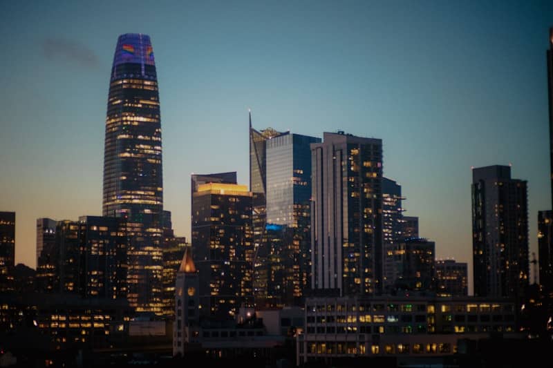 Skyscrapers light up the night sky.
