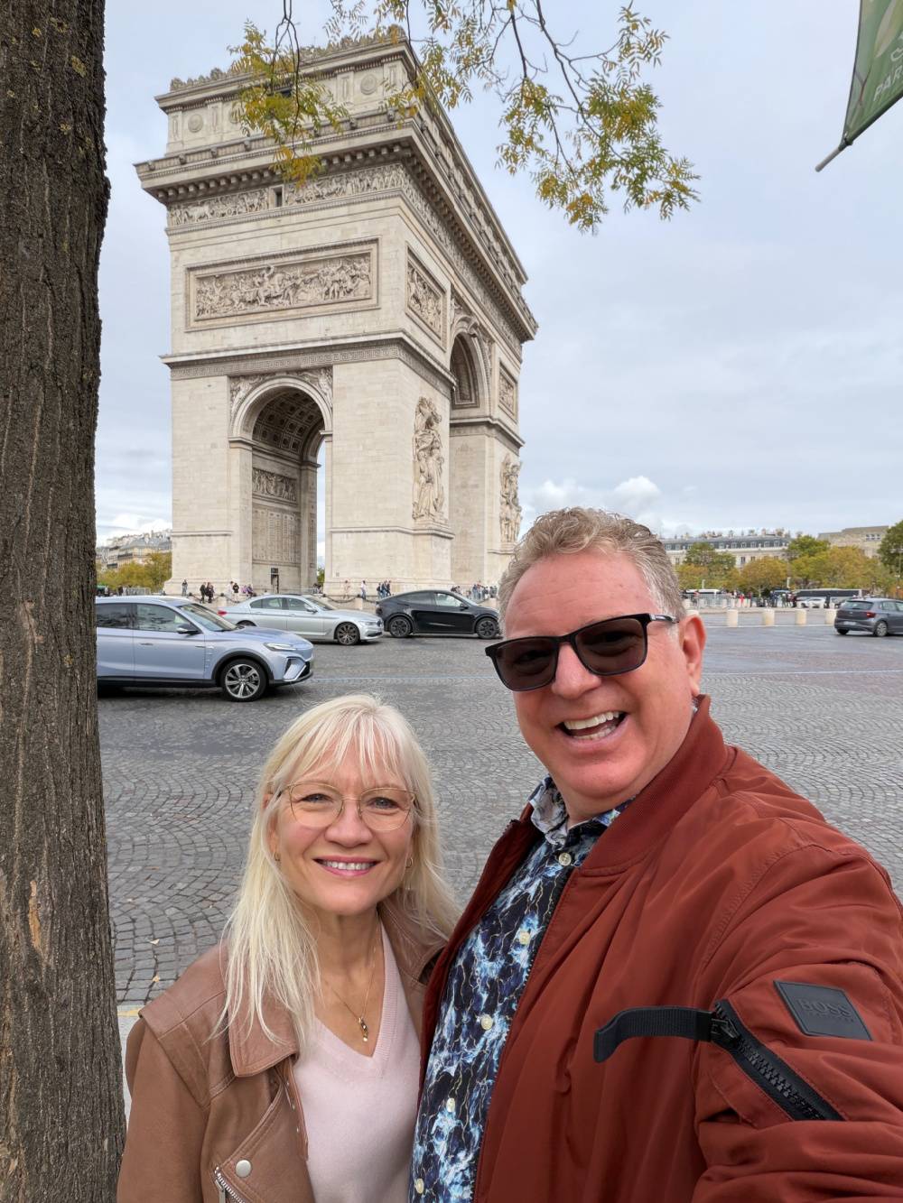 April and Guy Harris standing by the Arc du Triomphe in Paris