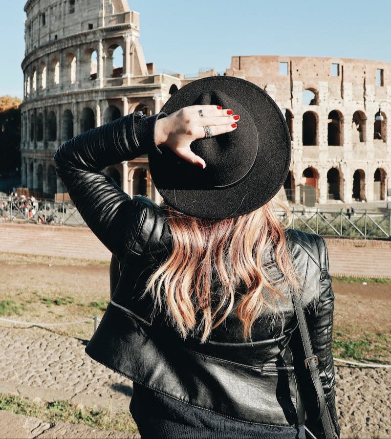 woman looking at Colosseum in Rome