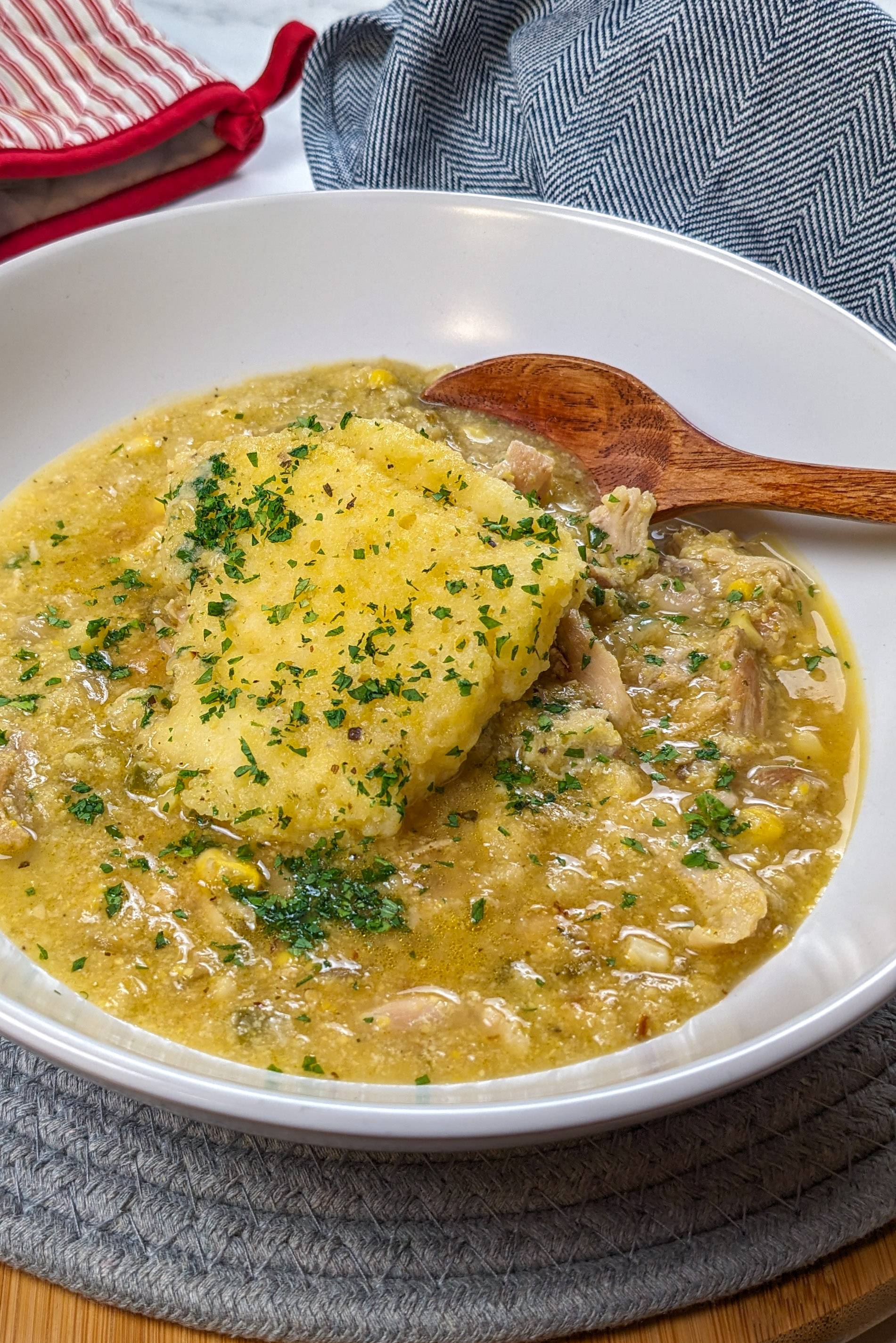 the Creamy Chicken Corn Chowder with cornbread Dumplings recipe in a wide rim bowl