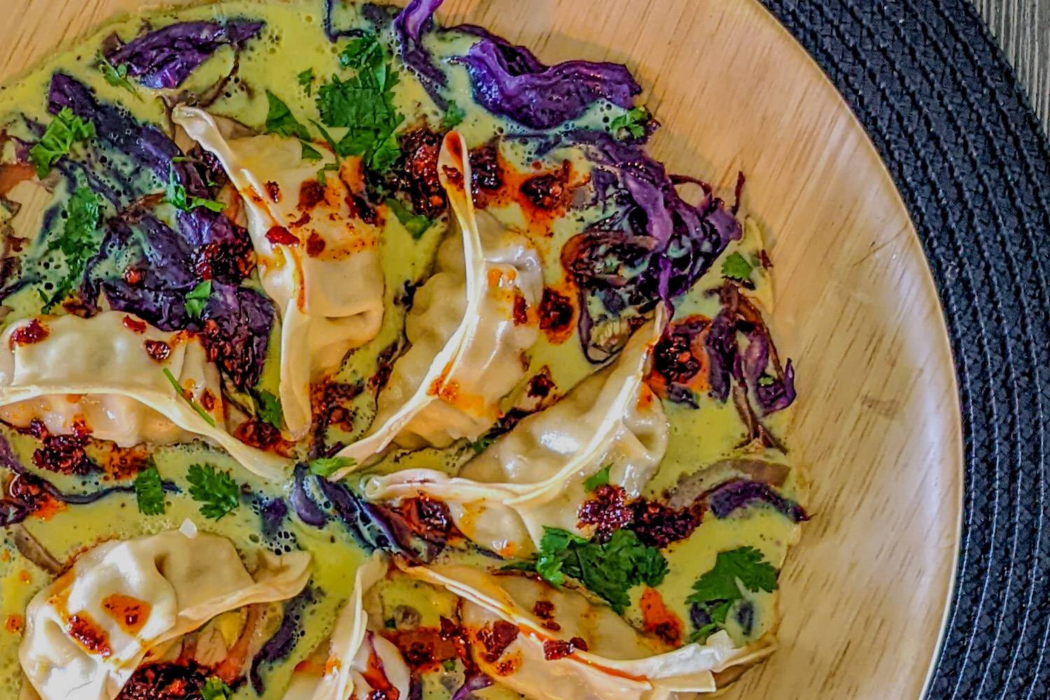potsticker egg winged with sauted red cabbage and onion.