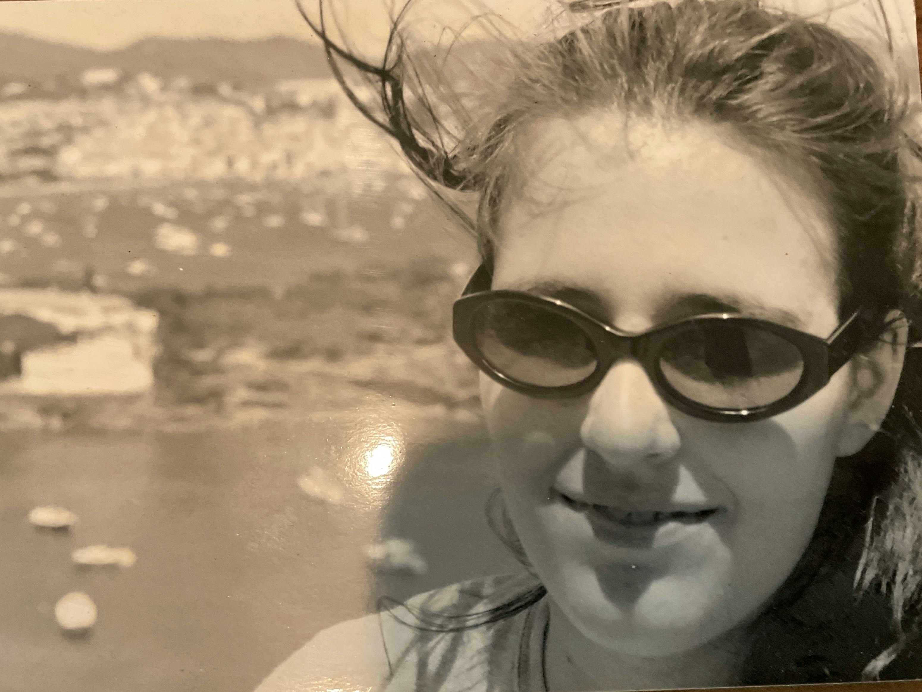 Sarah Moon in 1998 in Cadaques Spain; boats n the Mediterranean Sea in the background.o