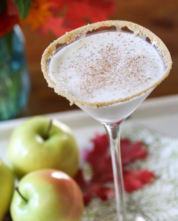 Caramel Apple Pie Martini with cinnamon and graham cracker garnish. 