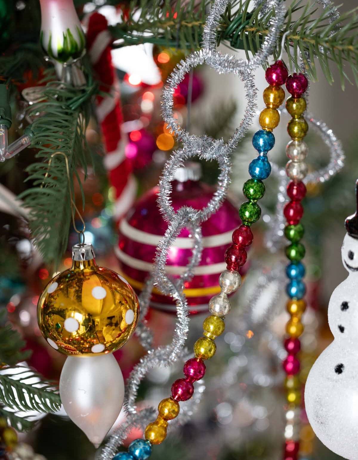 Pipe Cleaner Loop Garland hung on a christmas tree.
