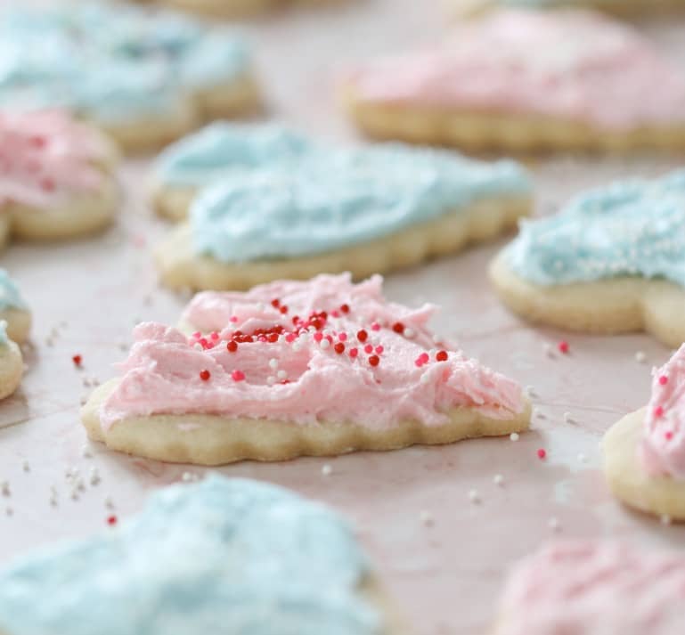 Sugar Cookies with Cotton Candy Frosting on a countertop.
