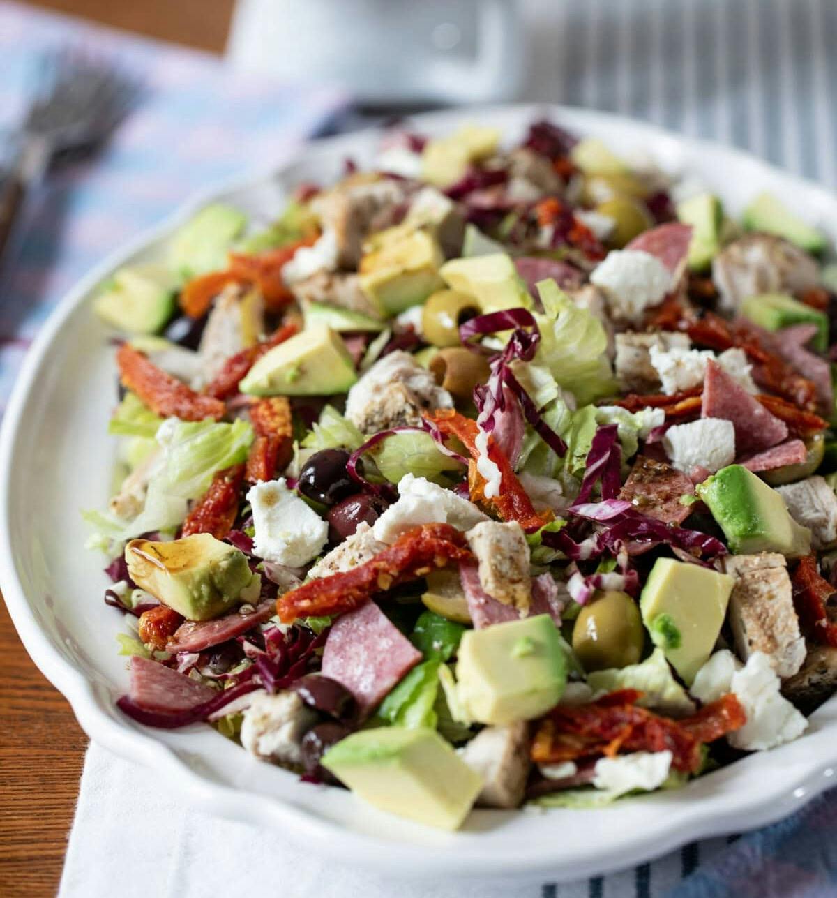 Antipasto Romaine Salad served on a large platter.