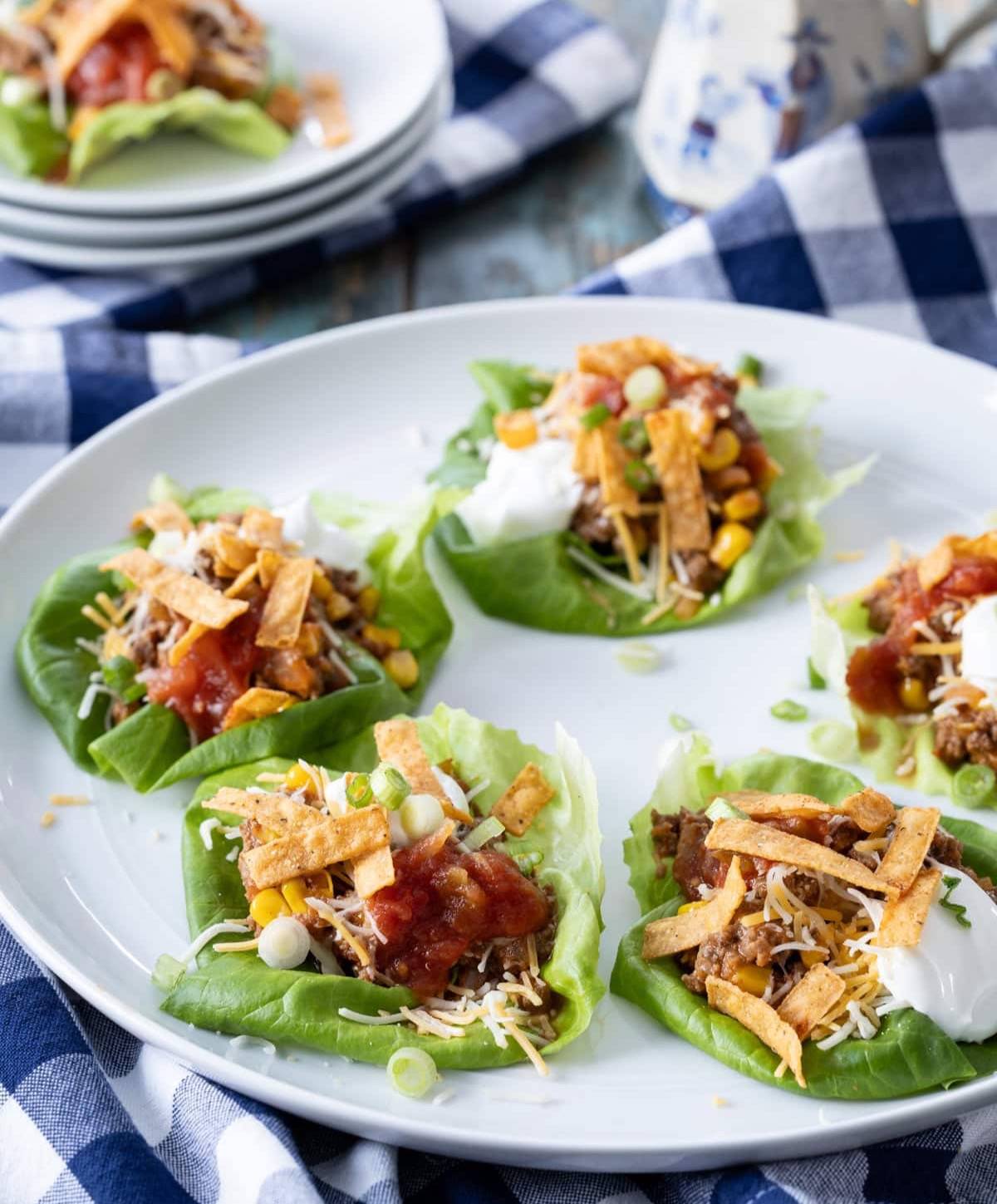 array of taco lettuce cups on a white platter. 