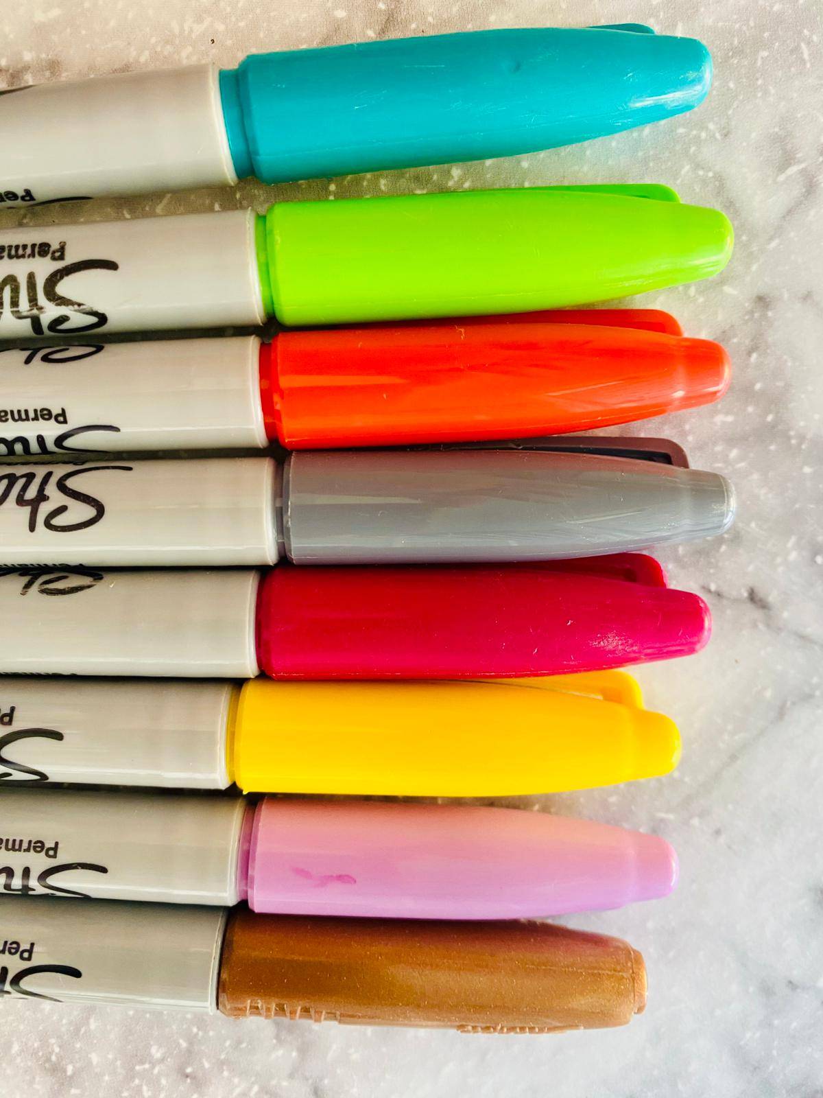 Image of Sharpie permanent markers in turquoise, florescent green, orange, silver, read, yellow, lilac and bronze.  Image taken by Sheela Hobden of www.bluegreencoaching.com