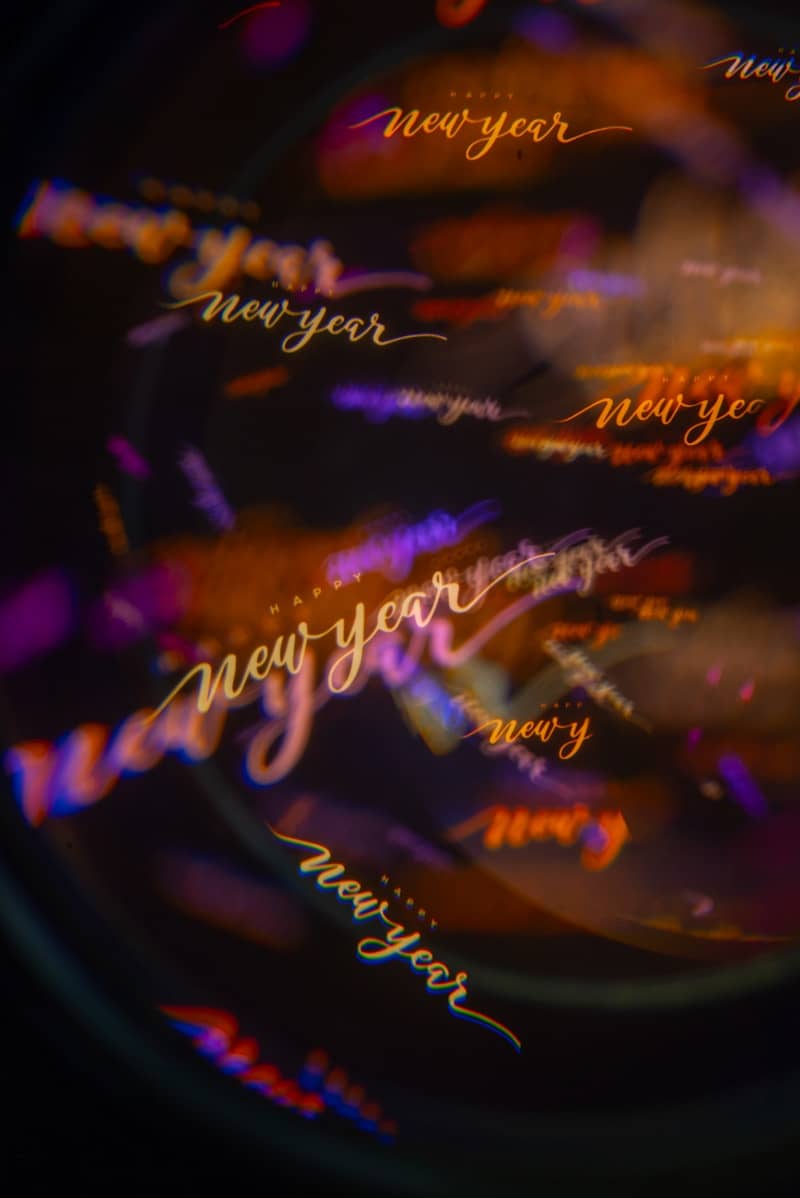 New year text with bokeh lights and color