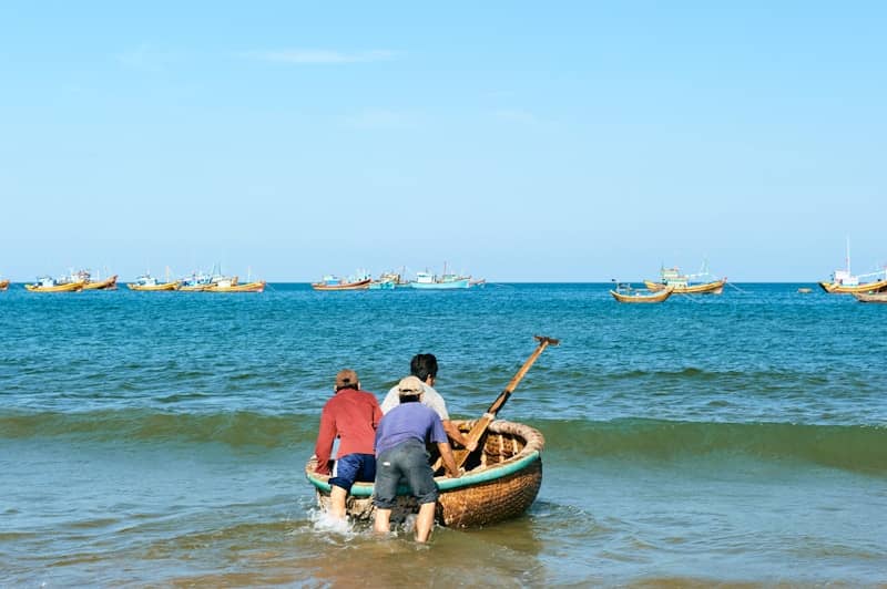 Push a boat into the ocean