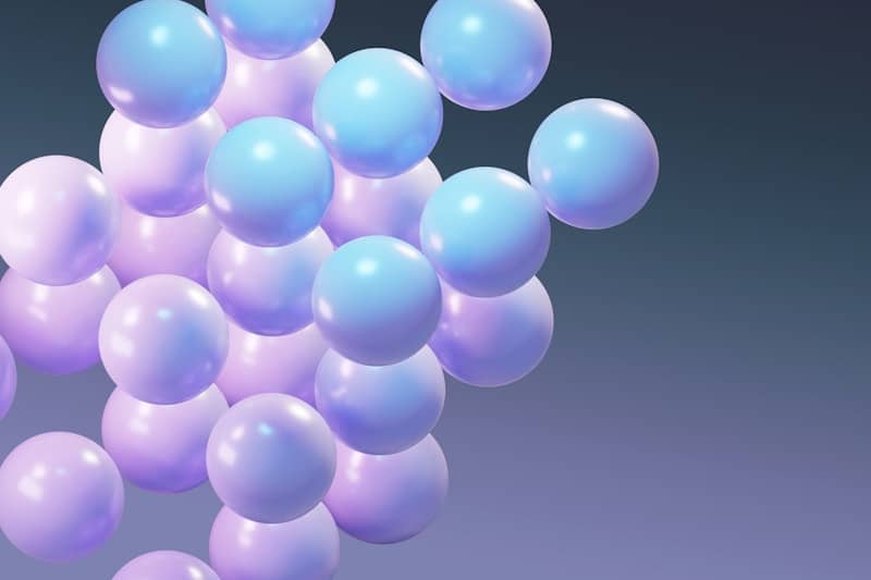 Cluster of pastel blue and purple spheres floating spheres.