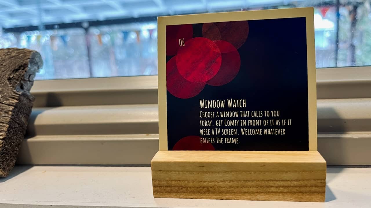 a Holiday Slowdown card reading "Window Watch: Choose a window that calls to you today. Get comfy in front of it as if it were a screen. Welcome whatever enters the screen."