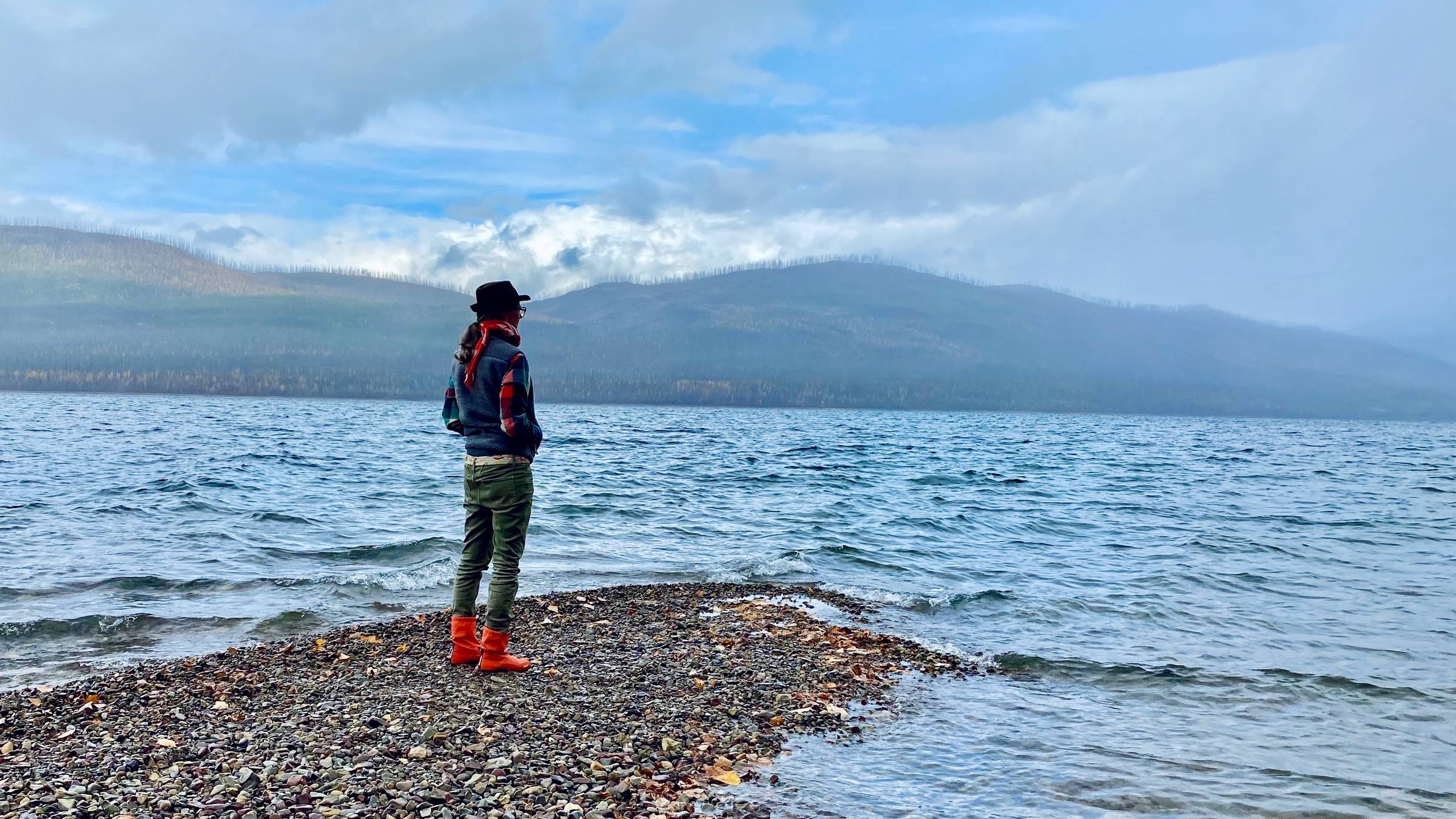 me, standing on the shore of a stormy Lake McDonald