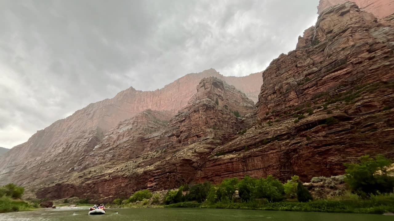 image of a white raft on the green river in Lodore Canyon, Utah