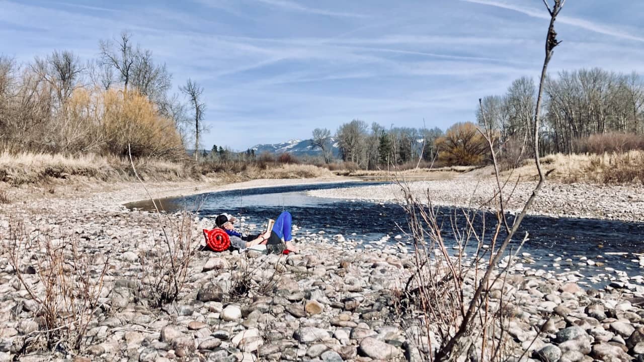 me, reading next to the Clark Fork River