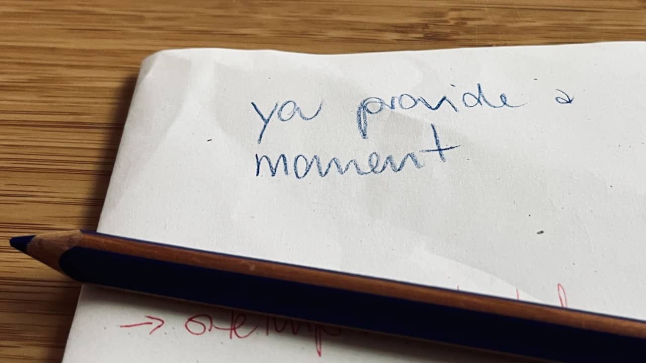 a note on scrap paper reading "you provide a moment"