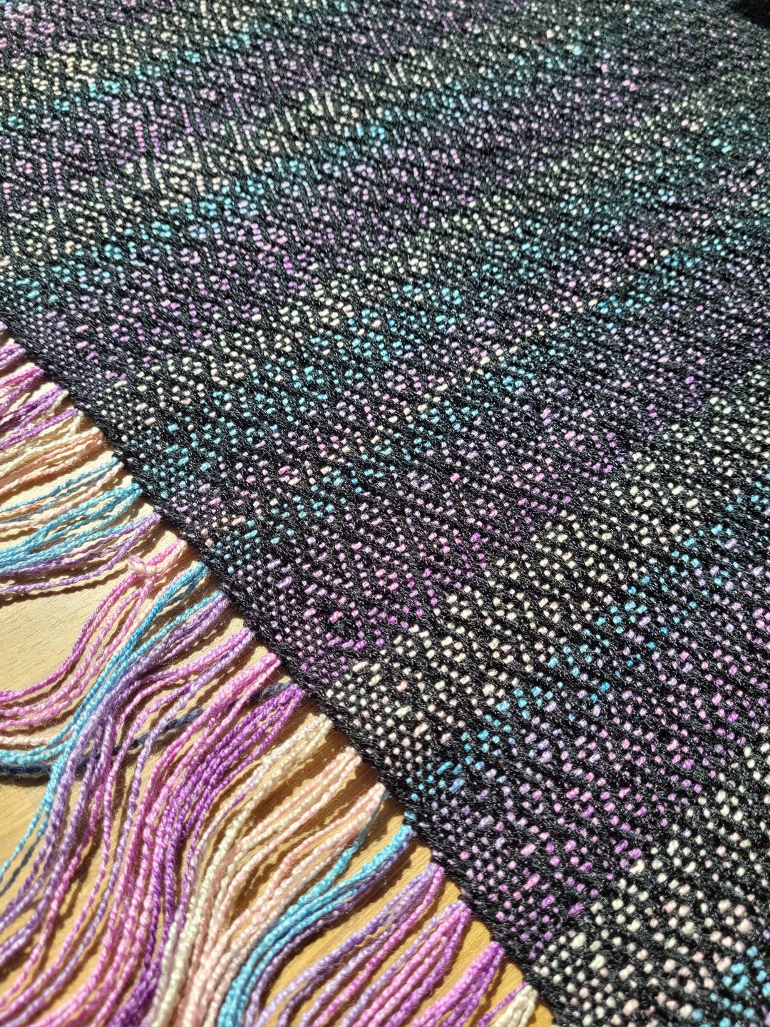 Handwoven diamond twill fabric; warp: lilac/sky blue/cream stripes, weft: black