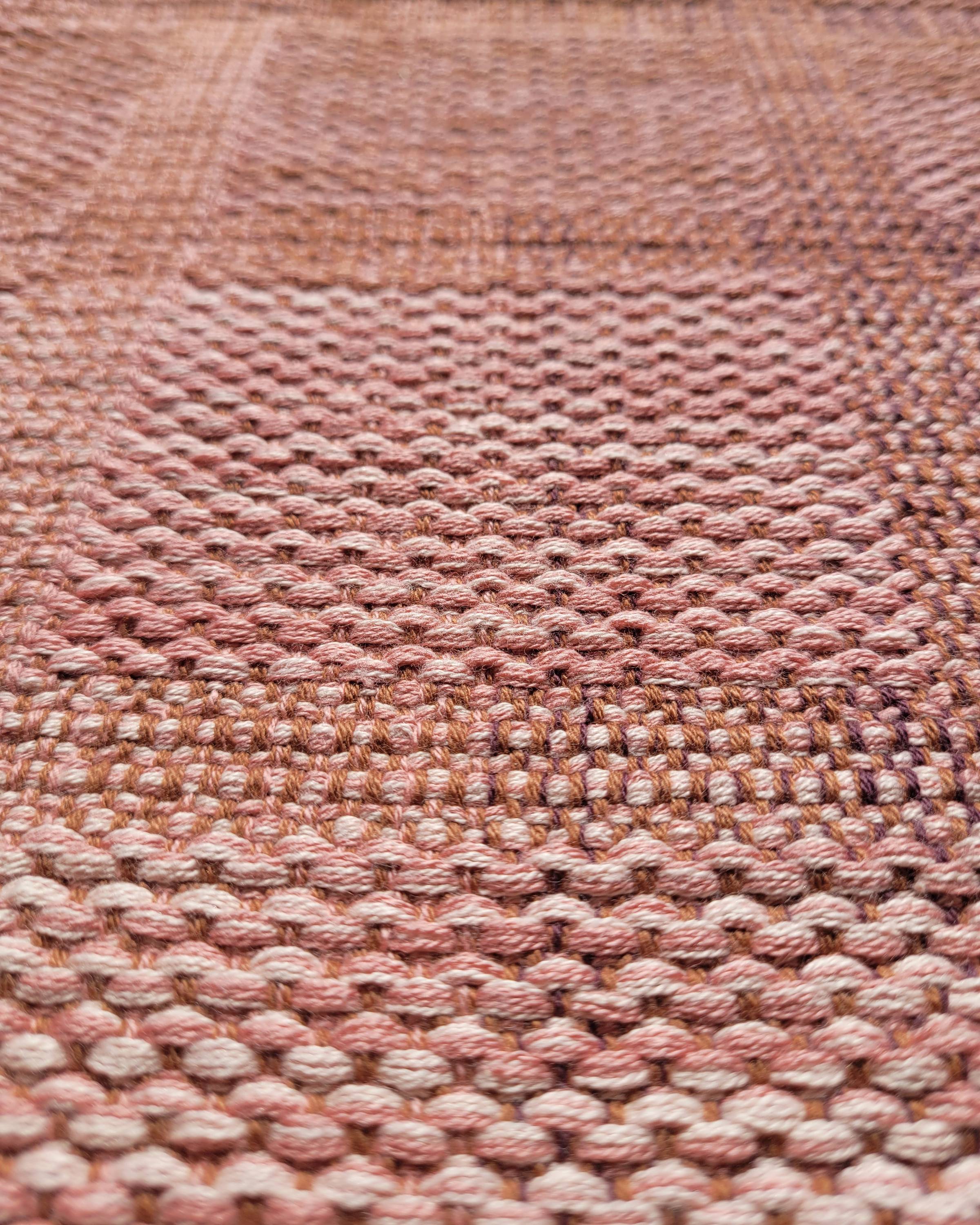 Detail shot of the nubbly texture of the brick squares on this project.