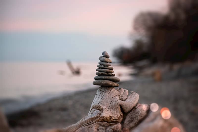 A close up of a person's hand with rocks on it