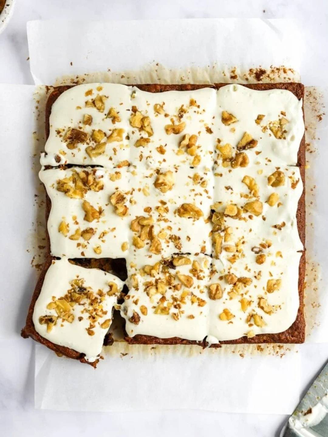 carrot bars with cream cheese frosting and walnuts.