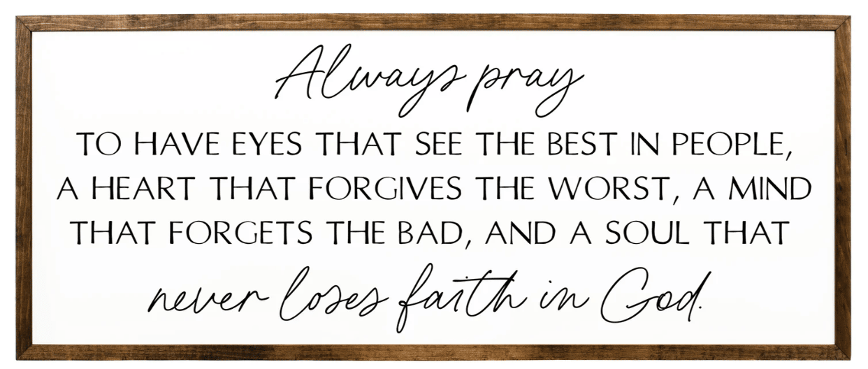 A sign with cursive on top and capital letters in middle