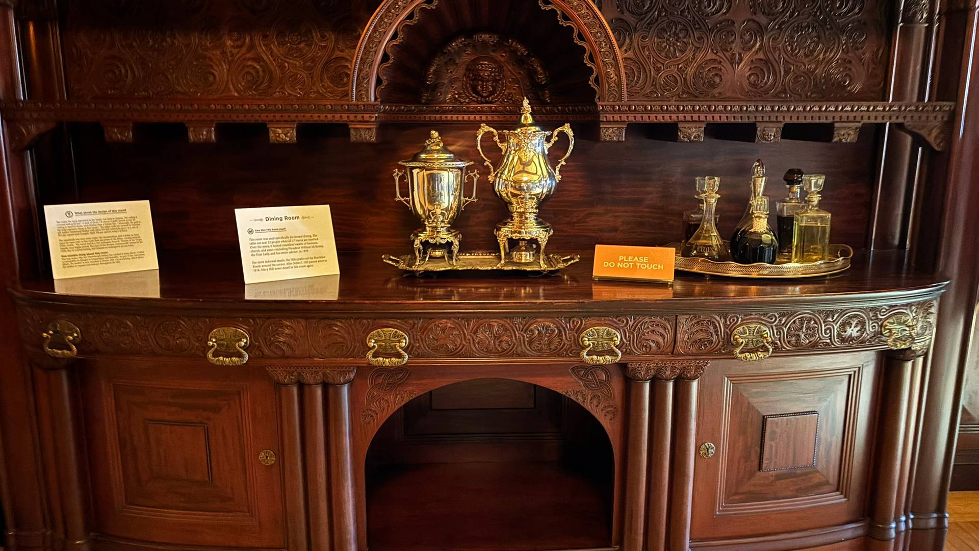 an ornate credenza in a dining room