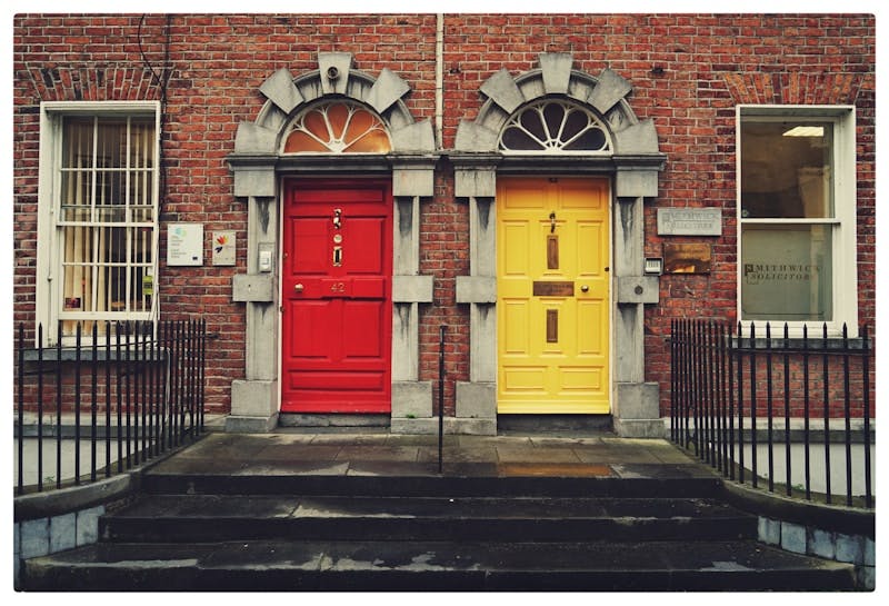 two yellow and red wooden doors