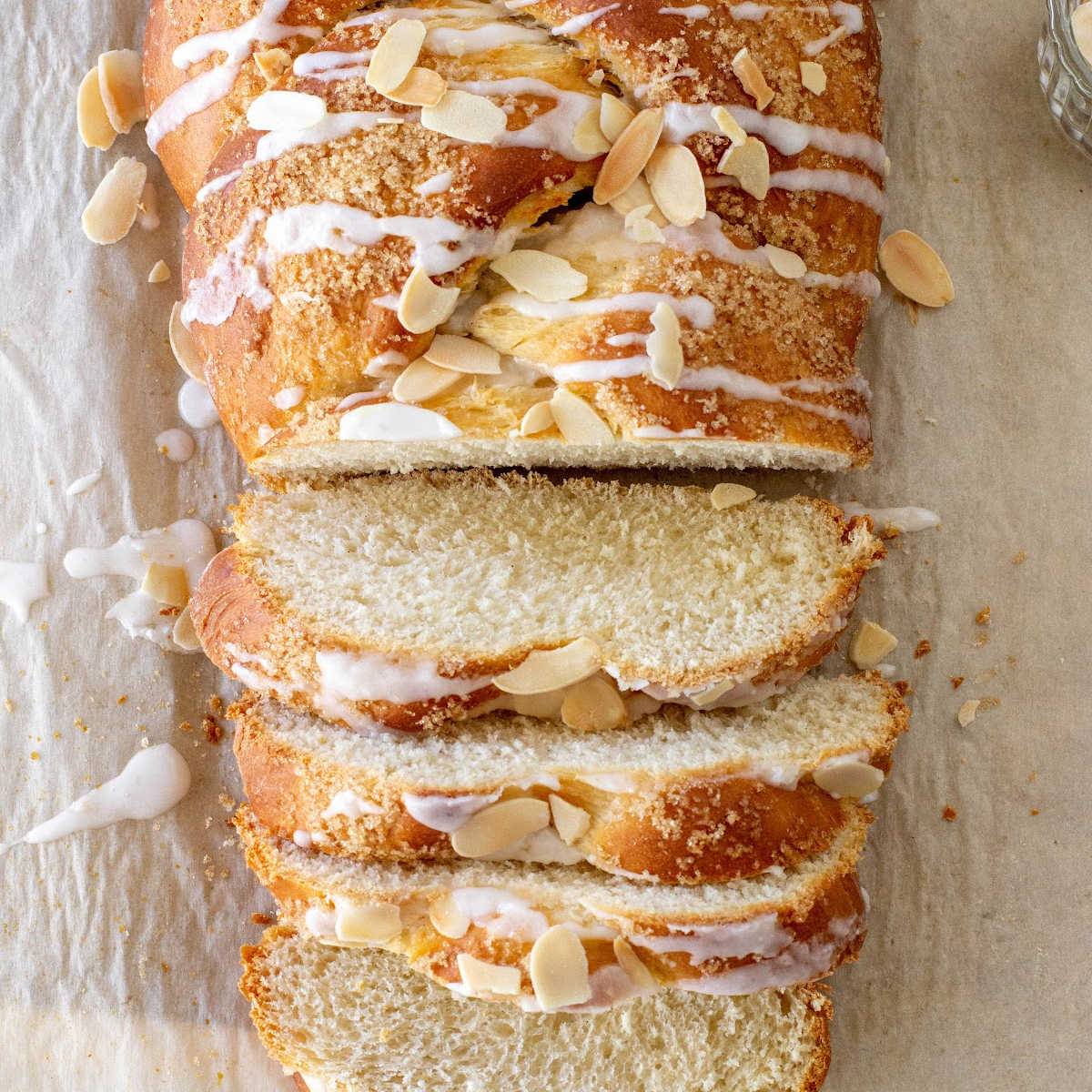 Glazed braided bread, whole and sliced.