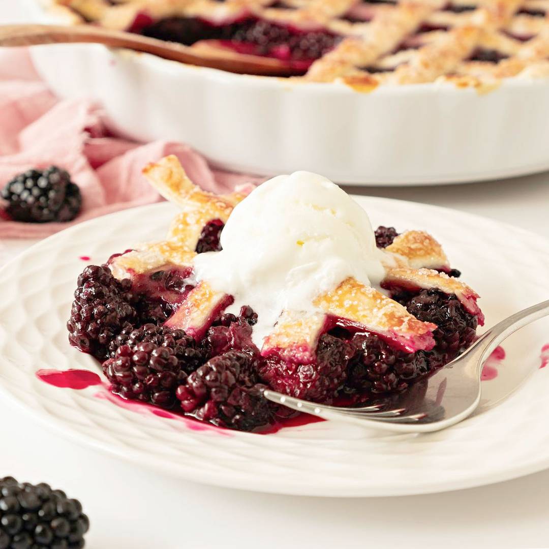White plate of blackberry pie crust cobbler. 