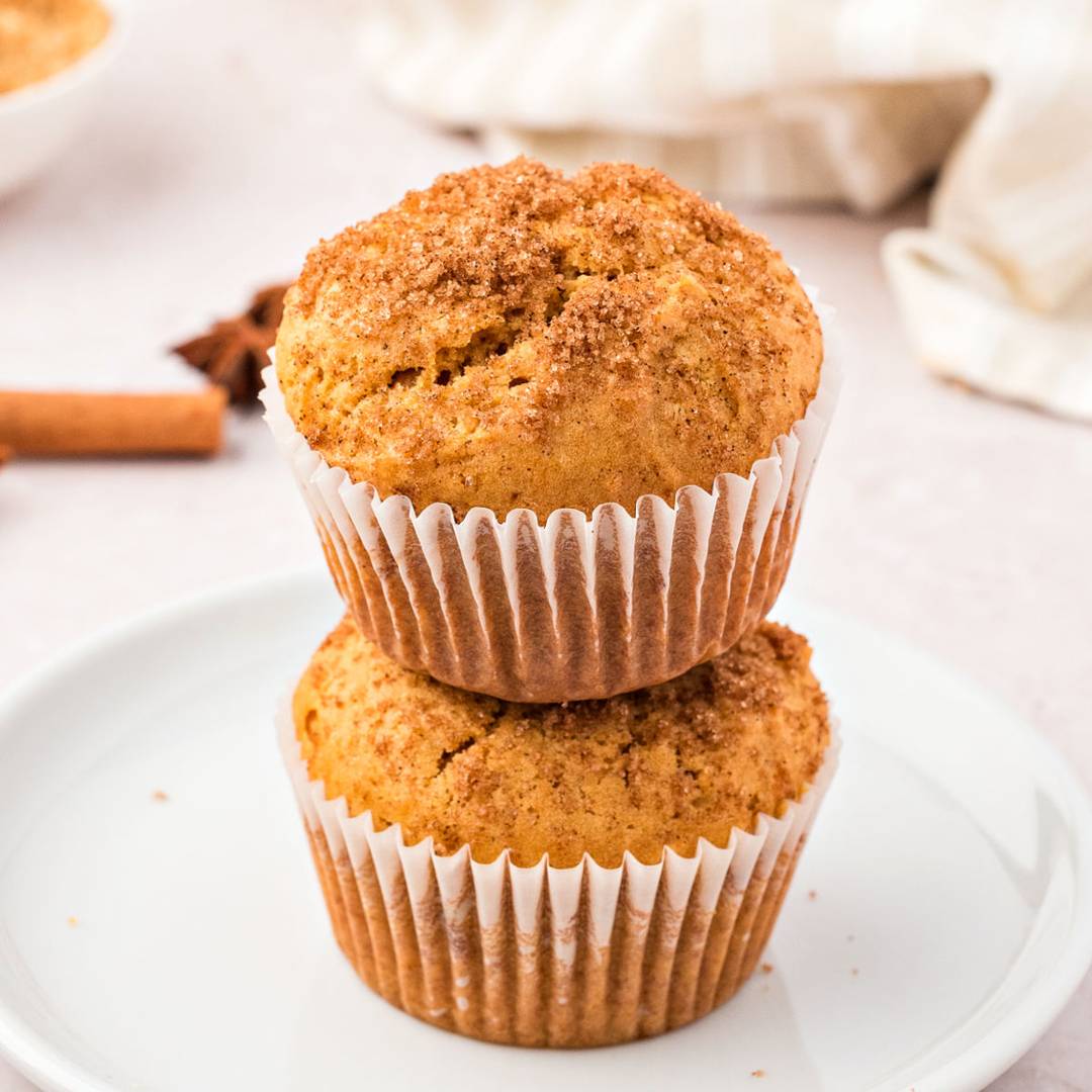 Stack of sweet potato muffins on a white plate. 