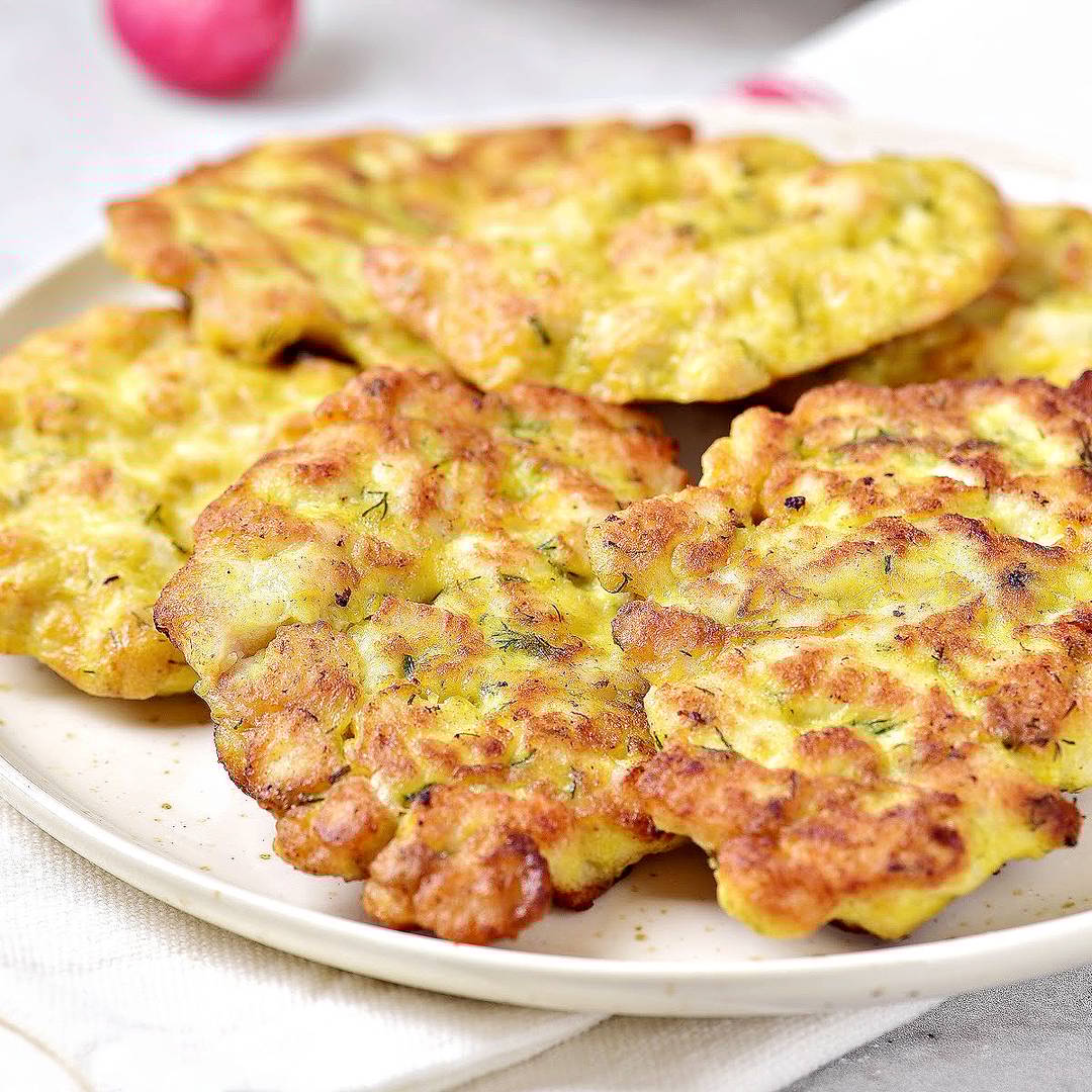 White plate of chicken fritters.