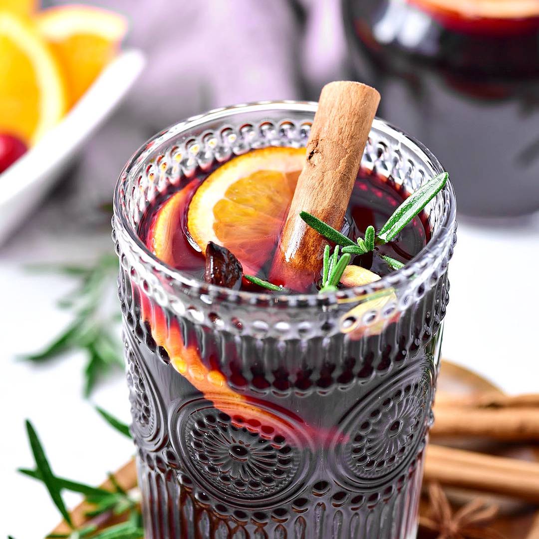Glass of spiced citrus mulled wine.