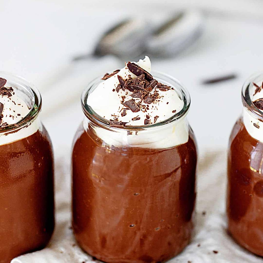 Jars of chocolate cream pudding.