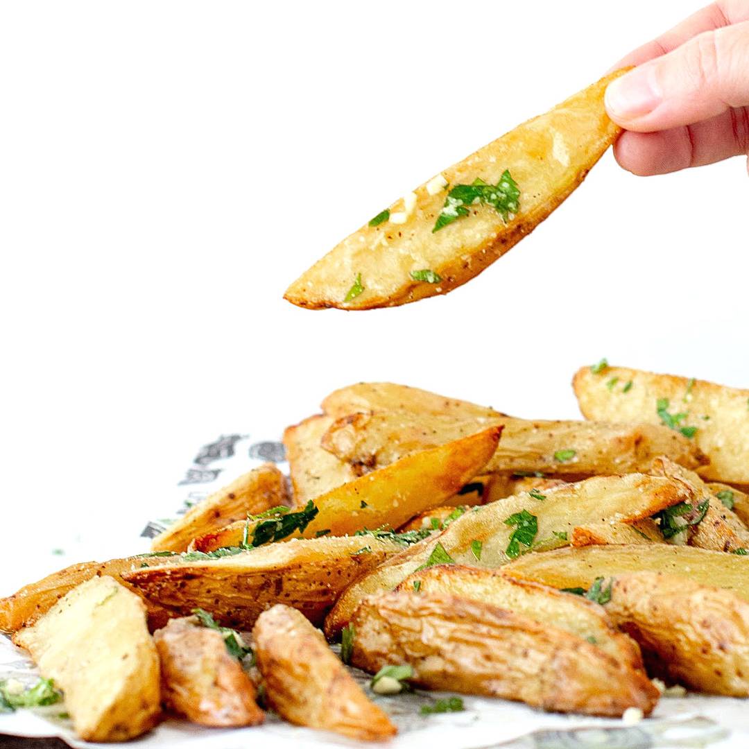 Mound of baked potato wedges.