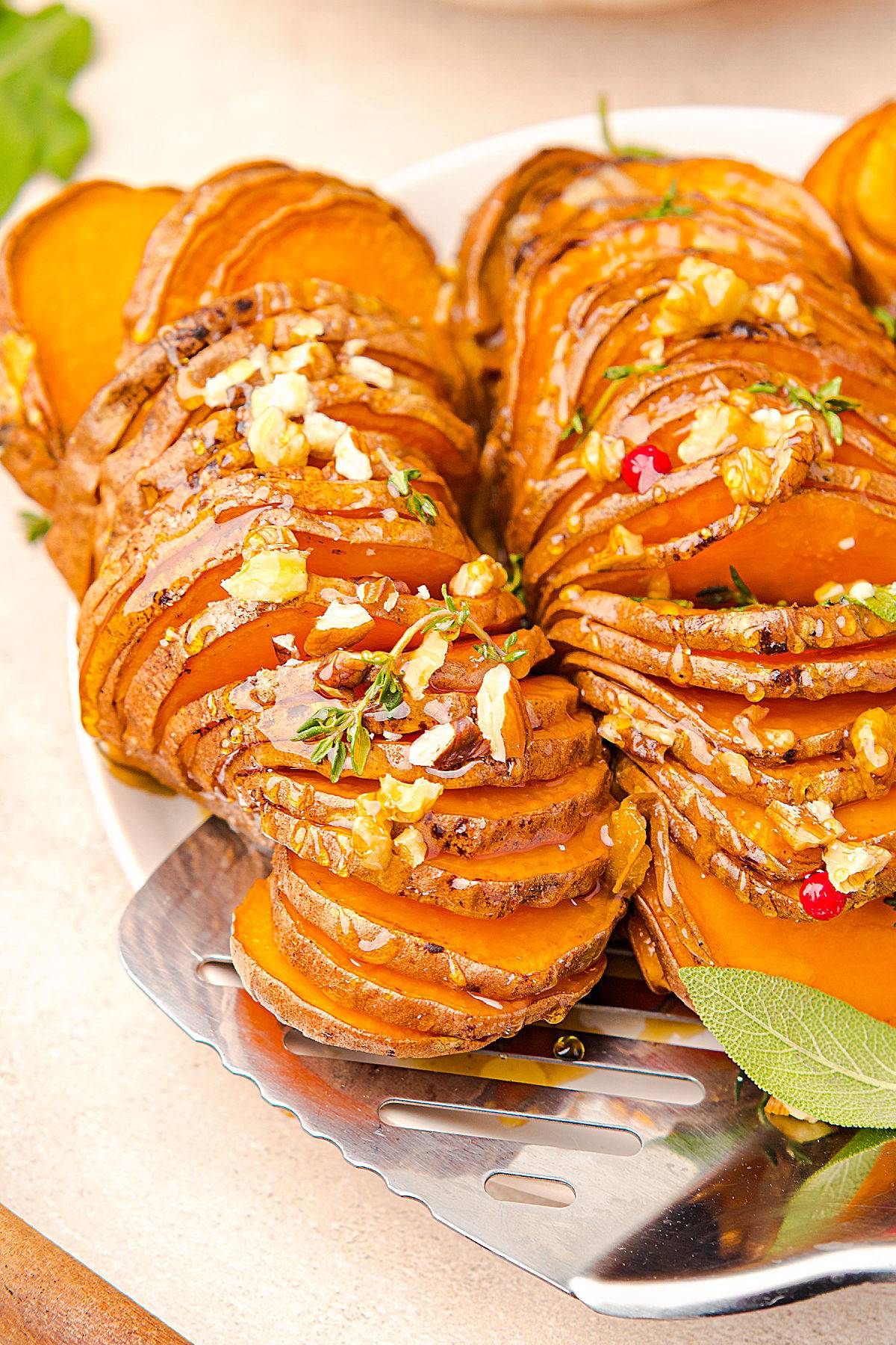 Hasselback-style honey sweet potatoes and walnuts.