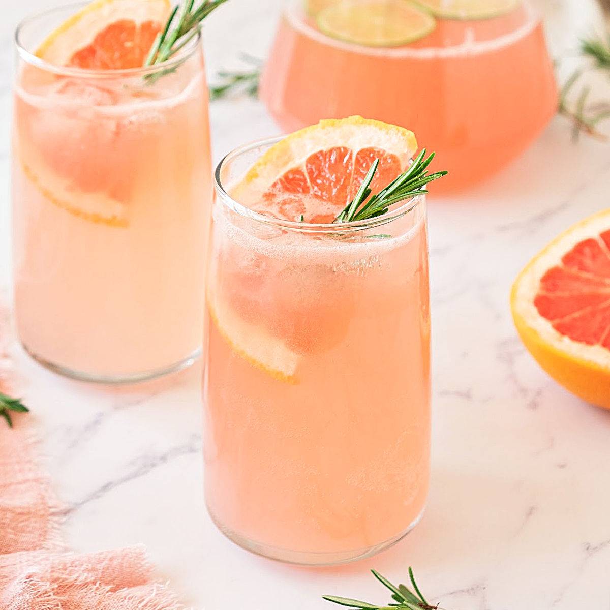 Highball glasses of grapefruit drinks.