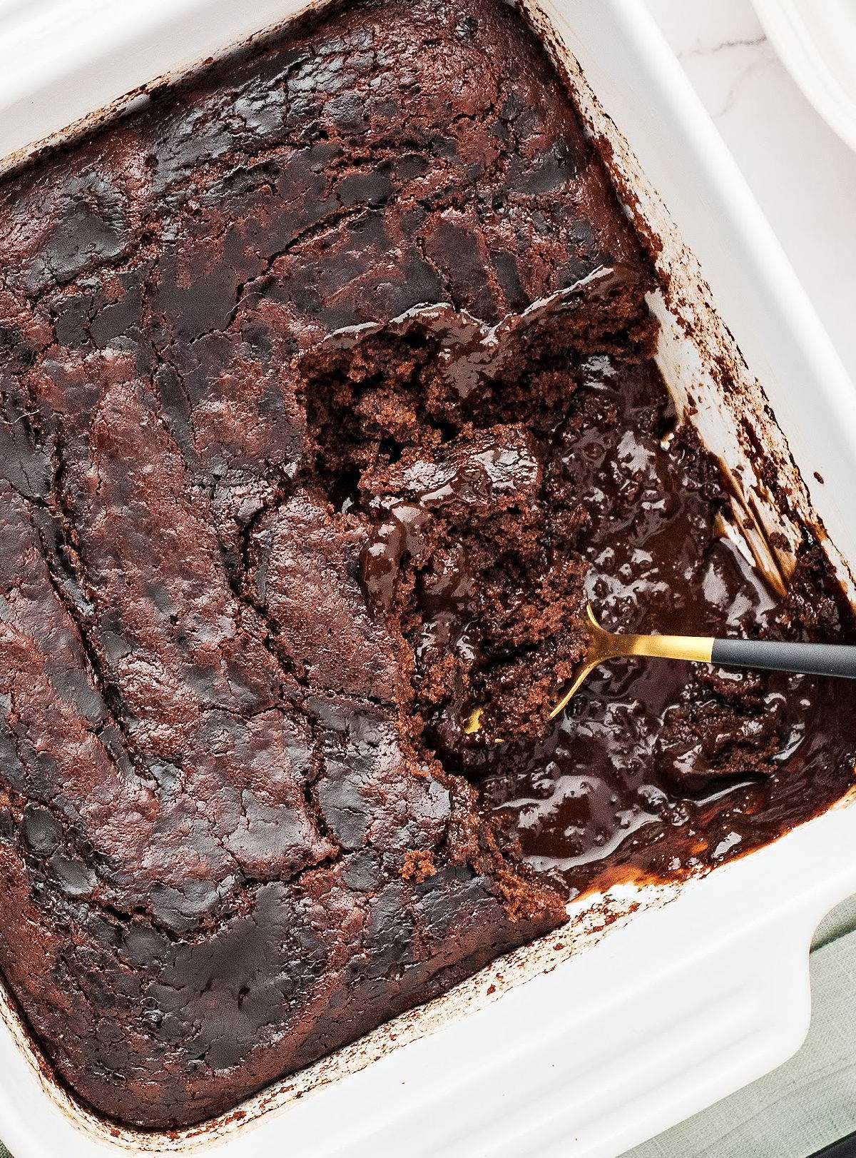 White dish of chocolate pudding cobbler. 