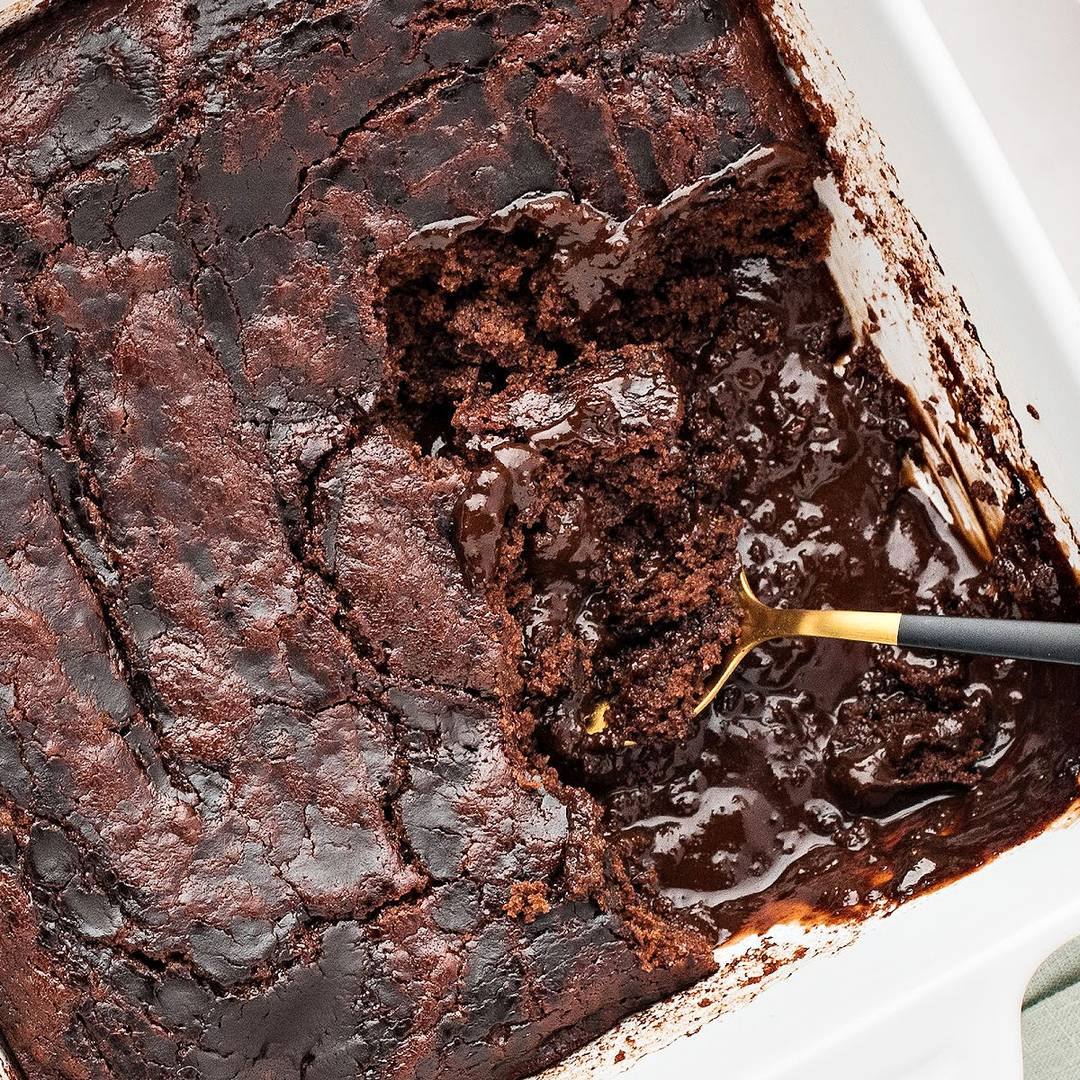 White dish of chocolate pudding cobbler.