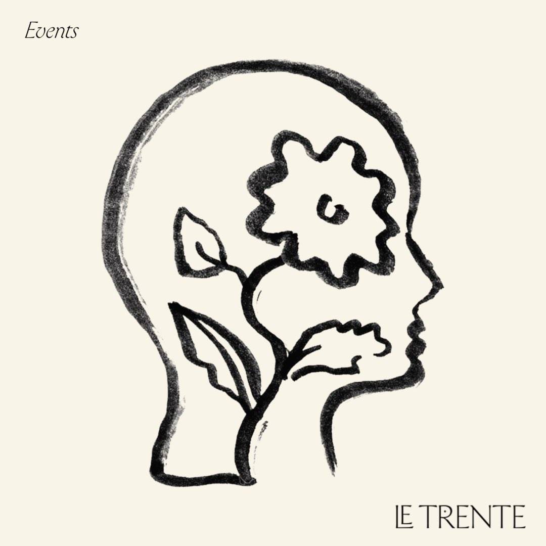A drawing of a face with a flower growing inside