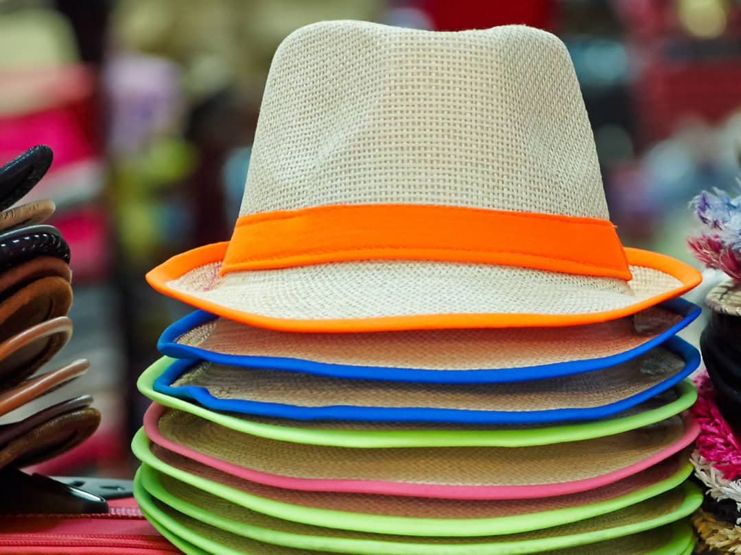 a stack of colorful hats