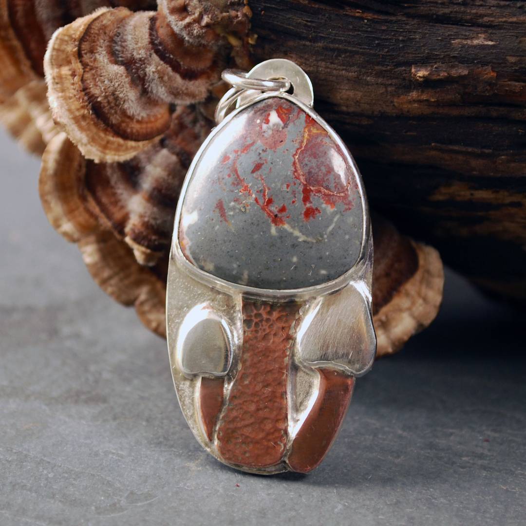 silver pendant with rhyolite mushroom cap, copper stem and two additional mushrooms